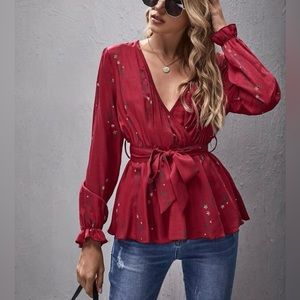 Long sleeve peplum top with floral pattern